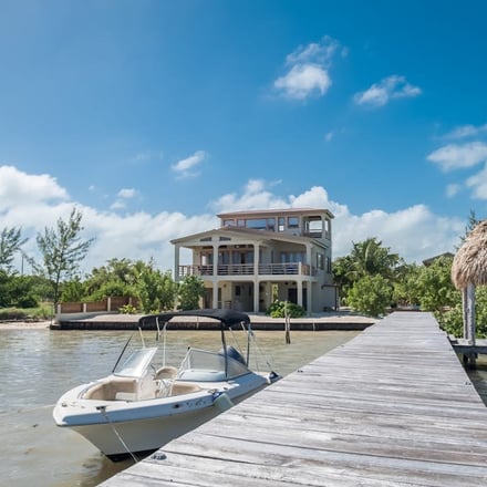 Beachfront property with dock and boat