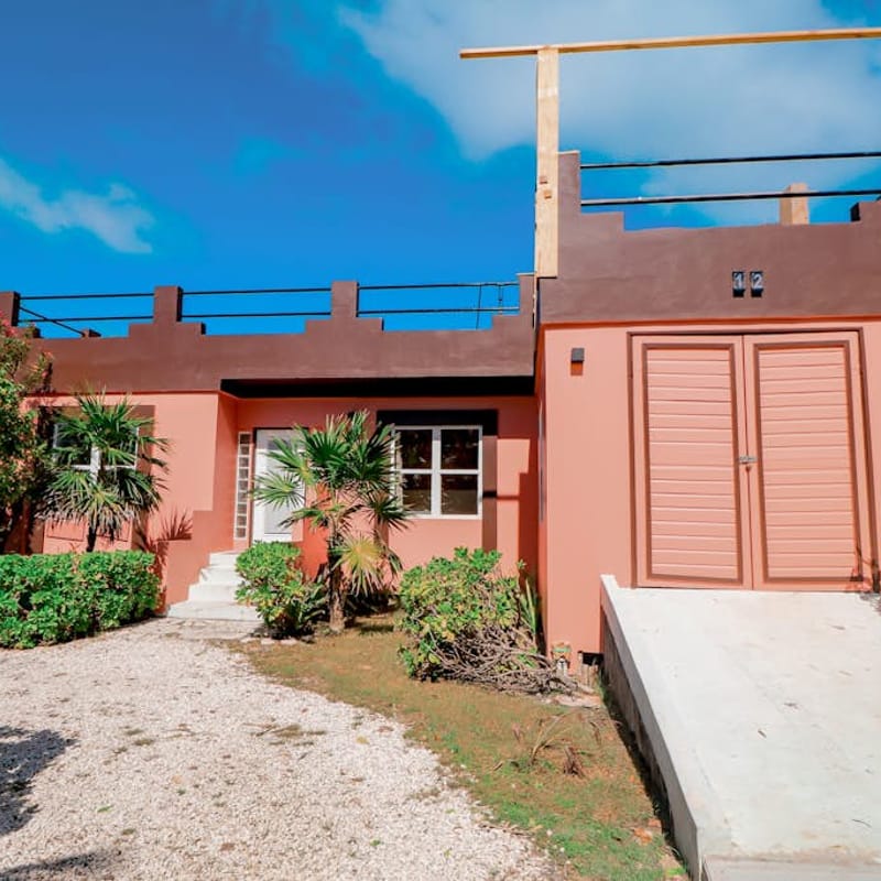 Beautiful lake-view villa with balcony, pool, & partial AC - near dining & shops